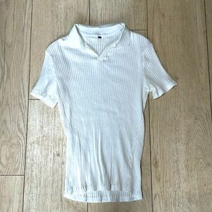 Dress shirt. Size small but fits like an XS good for under a blazer